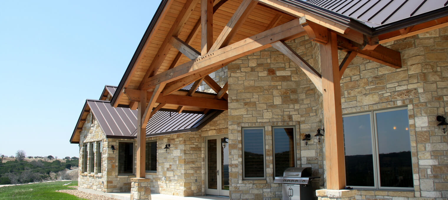 timber frame home porch trusses hill country home 10